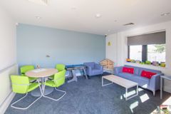 example of one of the family rooms, with books, toys and a sofa area