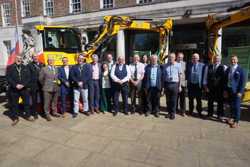 The ruling group pictured in front of the Pothole Pro machines