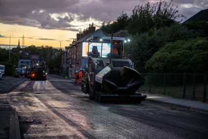 Heavy machinery working on a road in Mansfield at night
