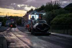 Heavy machinery working on a road in Mansfield at night