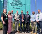 Council staff and Cllr James Walker Gurley stand outside Oak House 