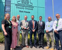 Council staff and Cllr James Walker Gurley stand outside Oak House 