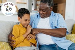 Foster Carer with foster child sat on the sofa