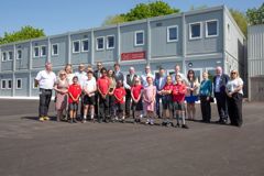 group photo of all the people, pupils and teachers who attended the official opening of the learning village 