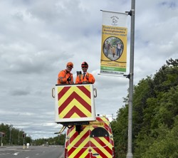 Fostering lamppost banner installation