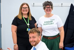 Officers standing with Councillor Rory Green. One of the women is wearing a t-shirt that says kinship support on it in green writing.