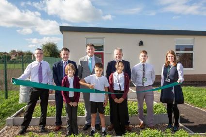 Nottinghamshire county councillors with staff and pupils from Leen Mills Primary School in Hucknall.