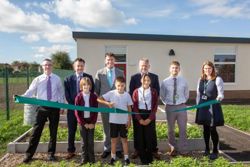 Nottinghamshire county councillors with staff and pupils from Leen Mills Primary School in Hucknall.